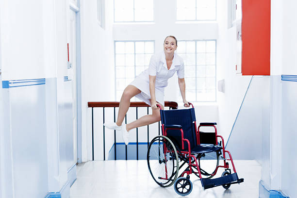 yippee.  enfermera pasos de aire, smilling. al final del turno, quizás? - naughty nurse fotografías e imágenes de stock