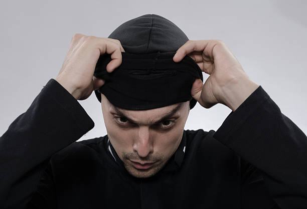 istock thief removes the mask 485470776