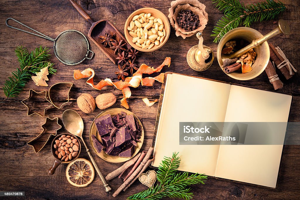 Spices for Christmas cakes Baking concept background with cookbook, spices and utensils for Christmas cookies Christmas Stock Photo