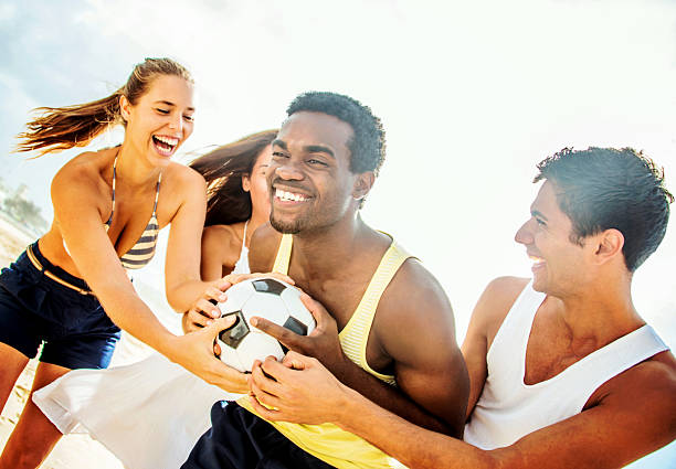 istock Friends playing football 485472793