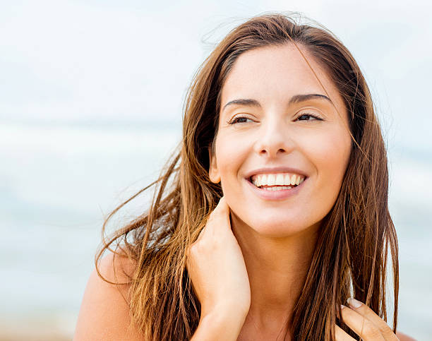 istock Beautiful woman at the beach 485472875