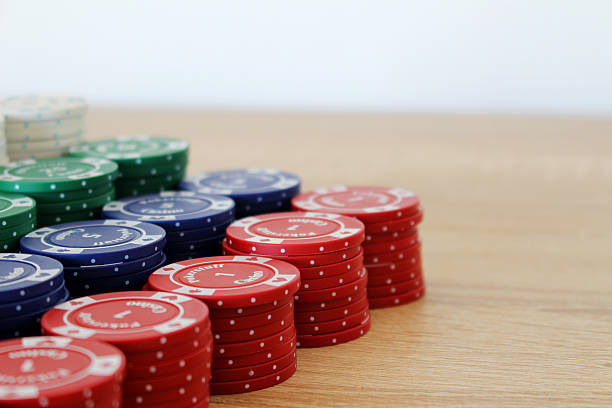 Big stack of colorful poker chips on a table stock photo