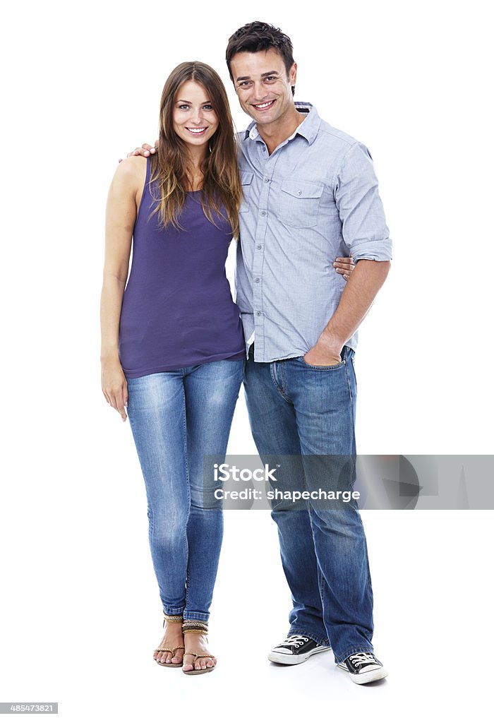 Confident couple Studio shot of a casual couple smiling at the camera 20-29 Years Stock Photo