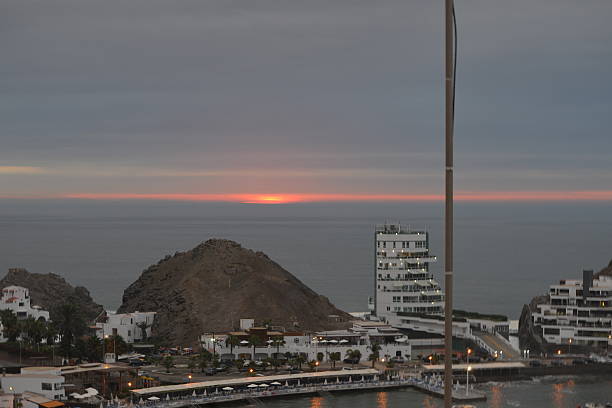 Sunset on the beach overlooking yacht club