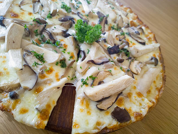 istock Pizza mushroom and cheese on a wooden board 485474379