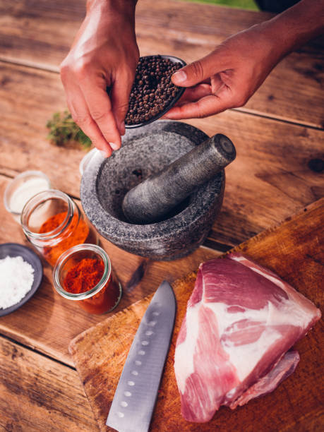 istock Pork with a mortar and pestle for making meat seasoning 485478490