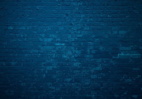 Old dark blue brick wall as background
