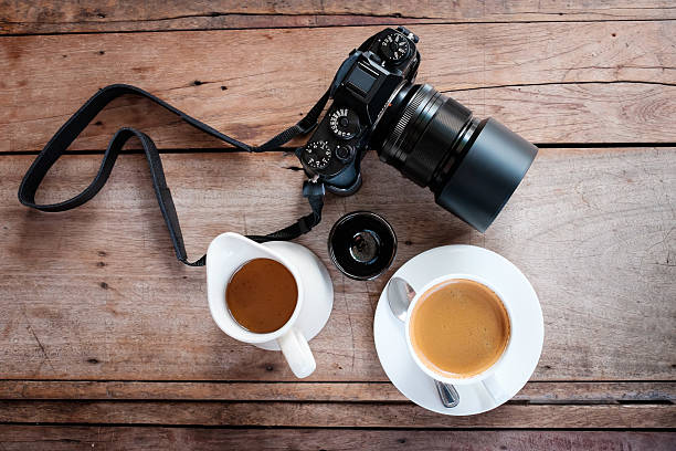 istock Hot coffee and tea with camera on a wooden table. 485480886