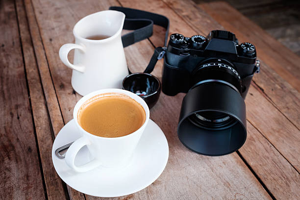 istock Hot coffee and tea with camera on a wooden table. 485480890