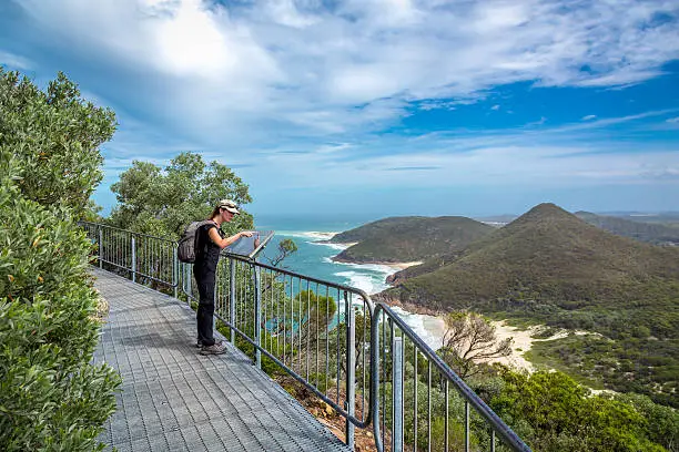 Photo of Woman Tourist Looking at Map, Nelson Bay, Port Stephens, Australia