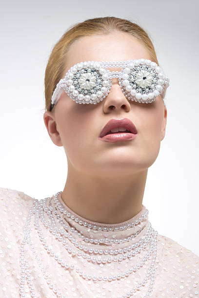 istock blond fashion model wearing pearl glasses 485487626