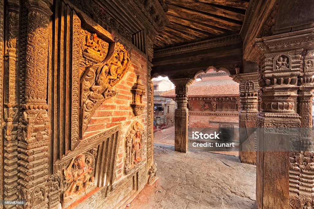 Columns of a Temple in Patan Durbar Square, Kathmandu, Nepal Patan Durbar Square is situated at the centre of Lalitpur city. It is one of the three Durbar Squares in the Kathmandu Valley. The structures of this square have been built in 17th century. Patan is one of the oldest know Buddhist City. It is a center of both Hinduism and Buddhism. 17th Century Stock Photo