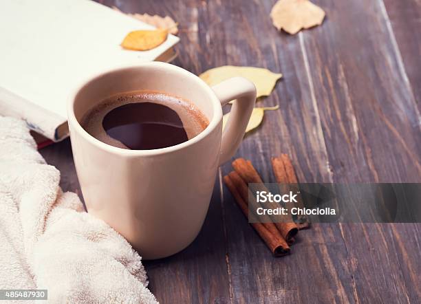 Coffee Leaves And Blanket On The Wooden Background Stock Photo - Download Image Now