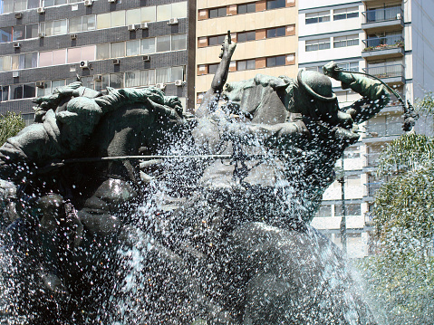 Statue Monument: The Entrevero Fabini Square, shows a fight between Indians and gauchos at the beginning of the country, Montevideo Uruguay, South America.