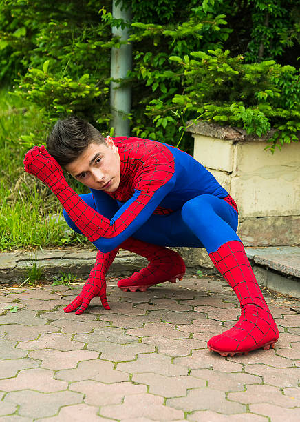 man  dressed in the costume spiderman - spider man stockfoto's en -beelden