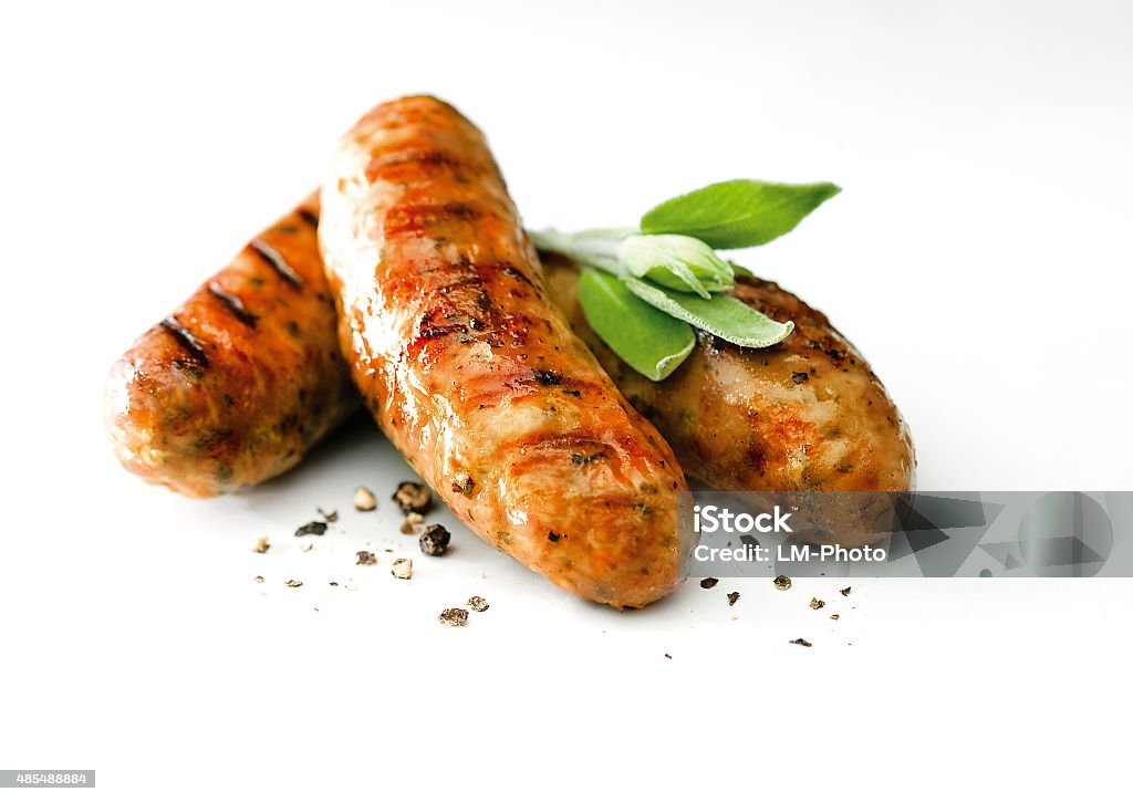 Saussages Pork sausages with black pepper sprinkles and garnish. High resolution Sausage Stock Photo