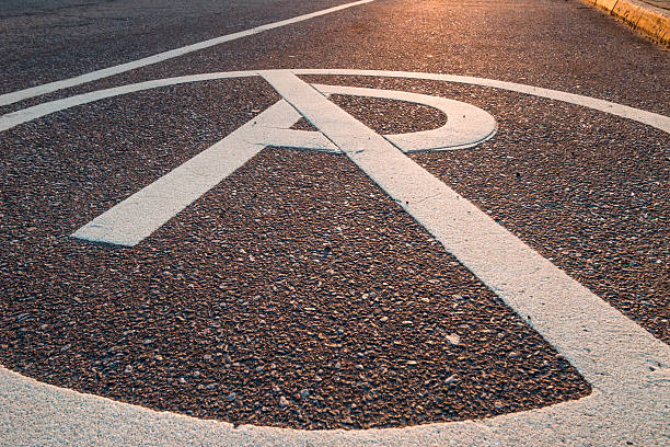 istock No Parking symbol on tarmac at sunset 485488937