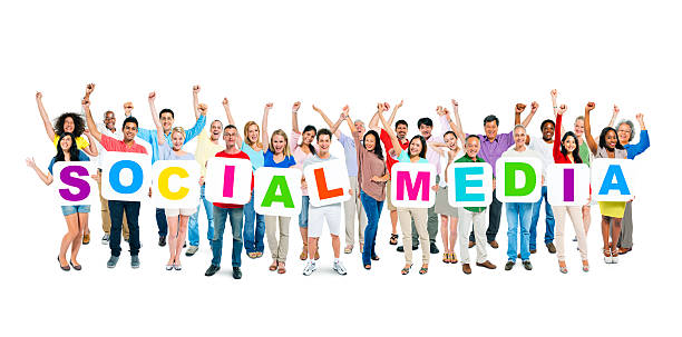 istock Multi-Ethnic Group Holding Letters To Form A Word Social Media 485490679