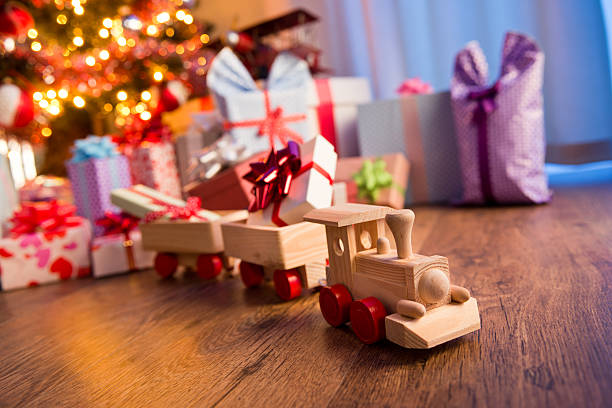 istock Wooden train with christmas gift 485491654