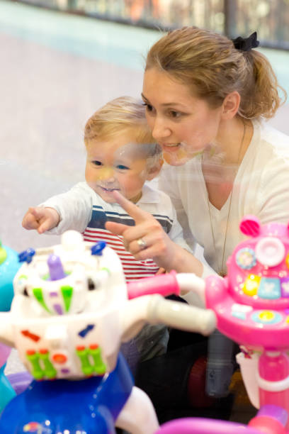 istock Mother and son at toy store display 485492165