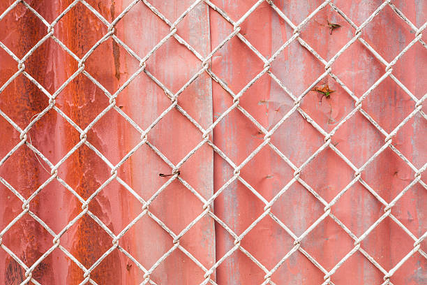 istock Wire Mesh and red corrugated fence 485492283