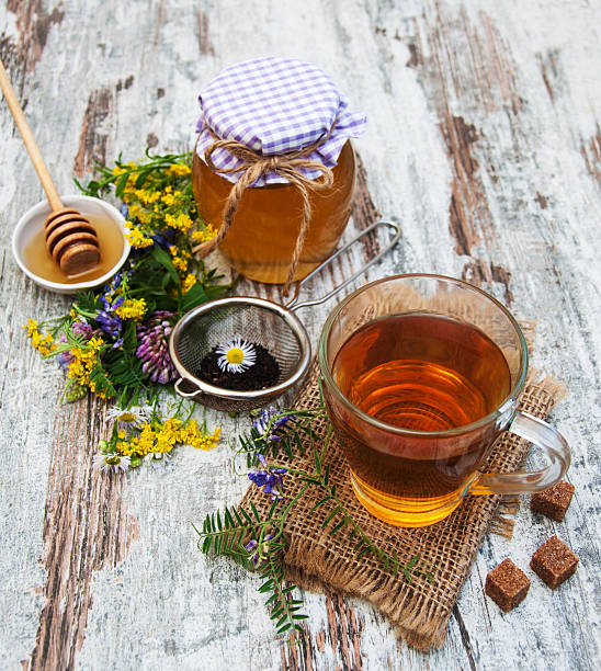 istock Cup of tea, honey and flowers 485492506