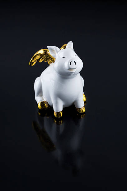 istock Porcelain Pig with golden wings 485492696