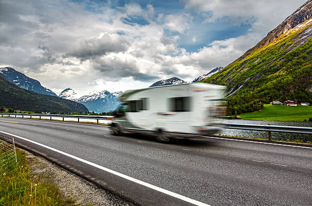 istock Caravan car travels on the highway. 485493024