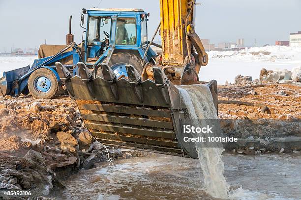 Excavator Rescue Operation Stock Photo - Download Image Now - 2015, Backhoe, Blue