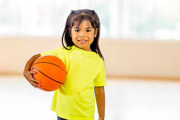 istock Girl Holding Basketball 485493374