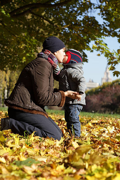 istock Mother kissing her son 485493386