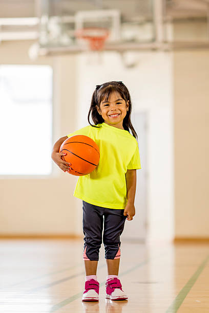 istock Girl Under Basketball Hoop 485493388