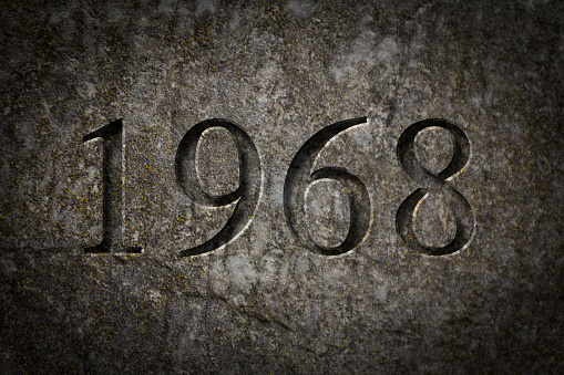 Historical year engraving 1968 on textured old surface