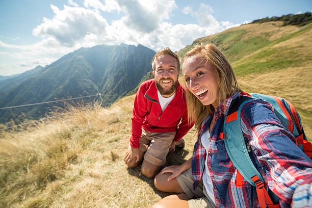 istock Cheerful couple taking selfie at mountain top 485497894