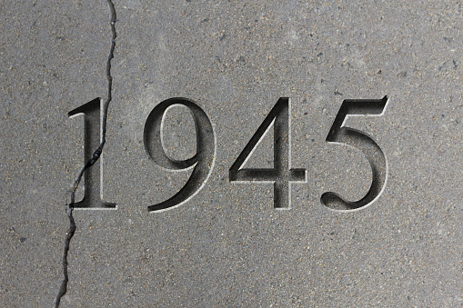Historical year engraving 1945 on textured old surface