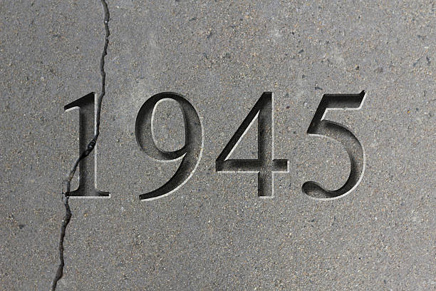 Engraved Historical Year 1945 Historical year engraving 1945 on textured old surface world war ii end stock pictures, royalty-free photos & images