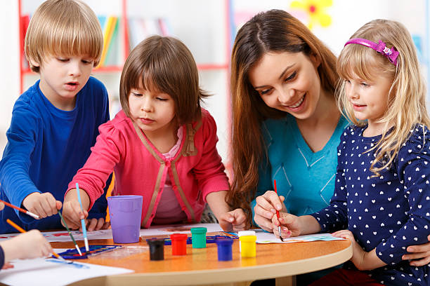 istock Group Of Elementary Age Children In Art Class With Teacher 485502929