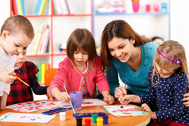istock Group Of Elementary Age Children In Art Class With Teacher 485502937