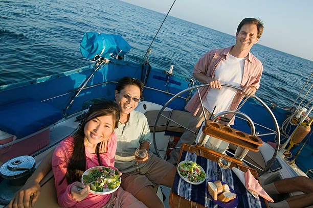 istock Friends Eating Salad on Sailboat 485503469