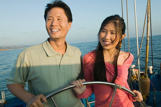 istock Couple at Helm of Boat 485503475