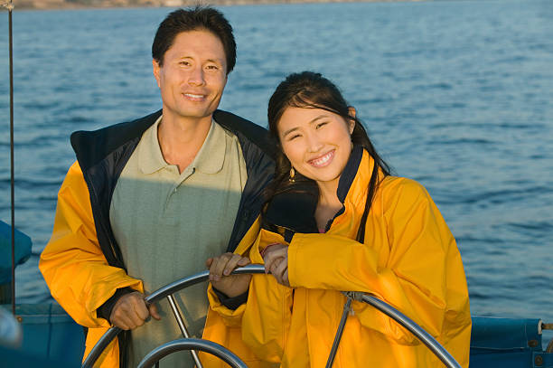 istock Couple at Helm of Boat 485503499