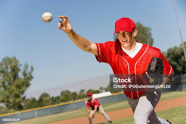 Pitcher Releasing Baseball Stock Photo - Download Image Now - Baseball Pitcher, Baseball - Sport, Throwing