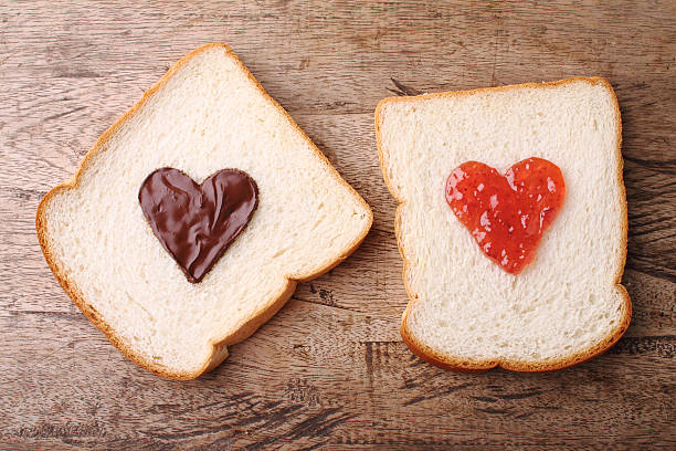 istock slice of breads with topping in heart shape 485504108