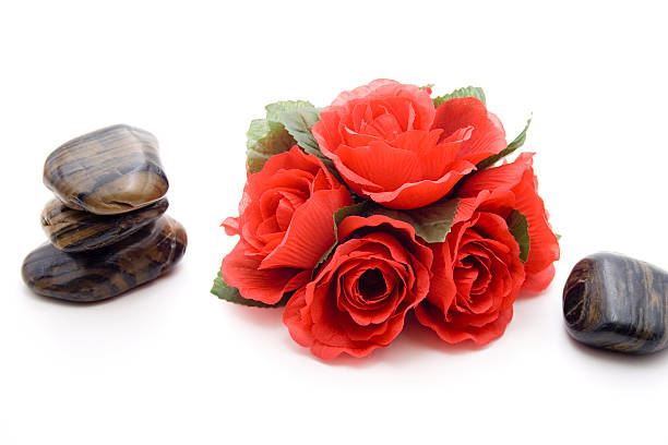 istock Rose flower arrangement with stones 485504861