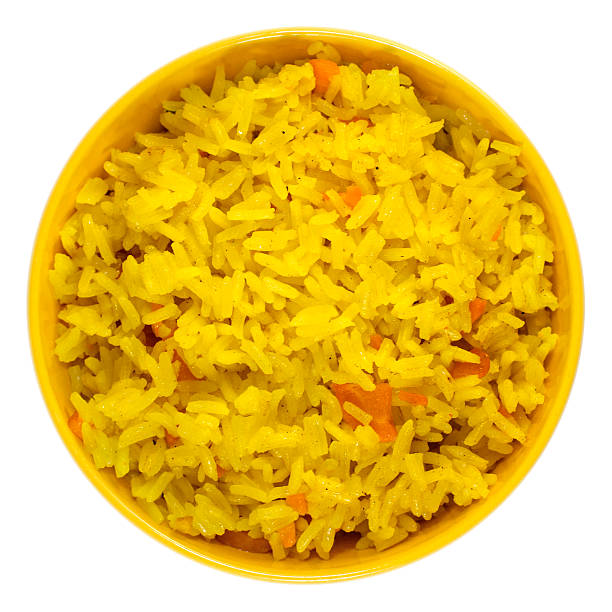 istock Boiled saffron rice with vegetables in yellow bowl 485505833