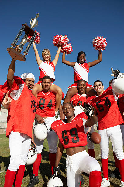istock Winning Football Players with Cheerleaders 485509657