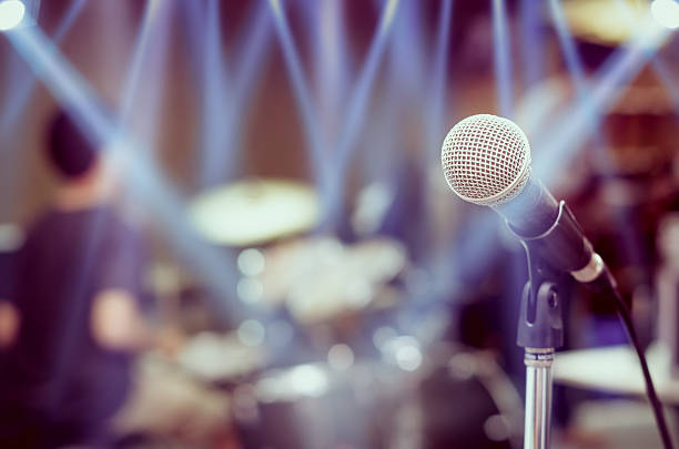istock Close up of microphone on musician blurred background 485511032