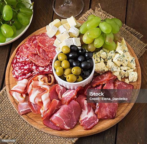 Antipasto Catering Platter With Bacon Jerky Salami Cheese And Grapes Stock Photo - Download Image Now