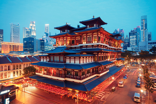 Buddha Toothe Relic Temple in Chinatown with Singapore`s business district in the background.