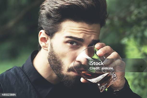 Bearded Man With Glass Of Whiskey Stock Photo - Download Image Now - Drinking, Men, Whiskey